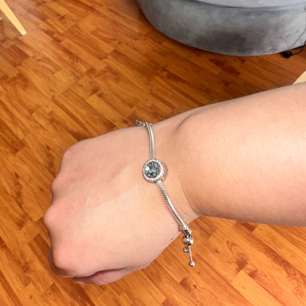 Authentic pandora silver bracelet charm with light blue accent